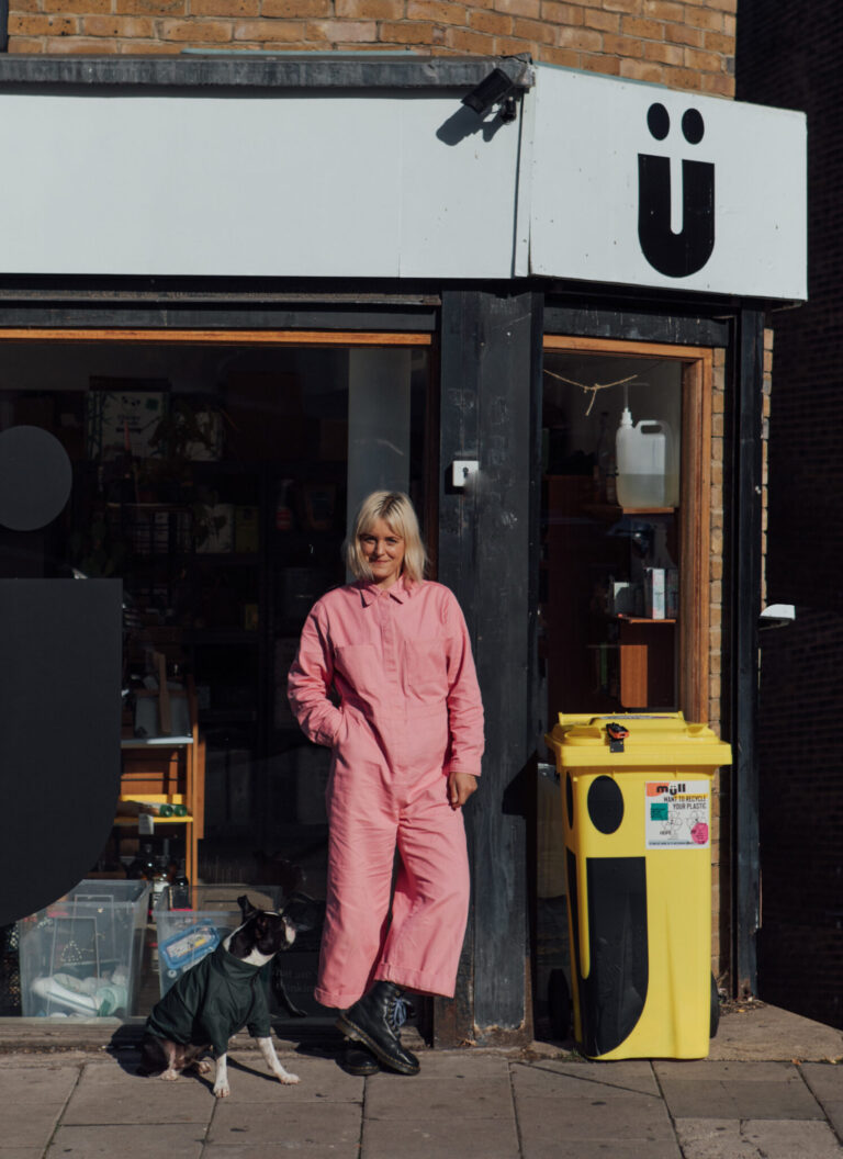 Charlie (lady with short blonde hair) stands in front of her shop.